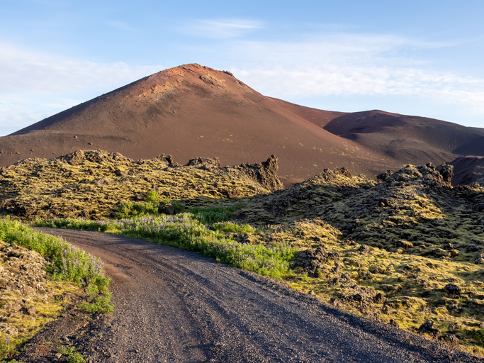 Lava fields road to the Eldfell volcano, Heimaey, Vestmannaeyjar islands, Iceland. Its 1973 eruption caused major destruction and increased the area of the island significantly.
