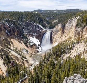 Hot spring, icy lake, nature, wild life, meadow, grand canyon of Yellowstone in Spring 2022