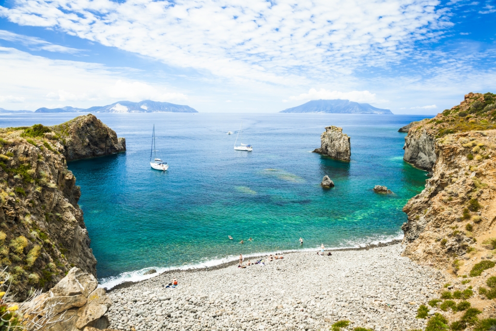 Cala Junco - small bay of Panarea - one of Aeolian Islands near Sicily (Italy). Lipari and Salina islands visible on the horizon.