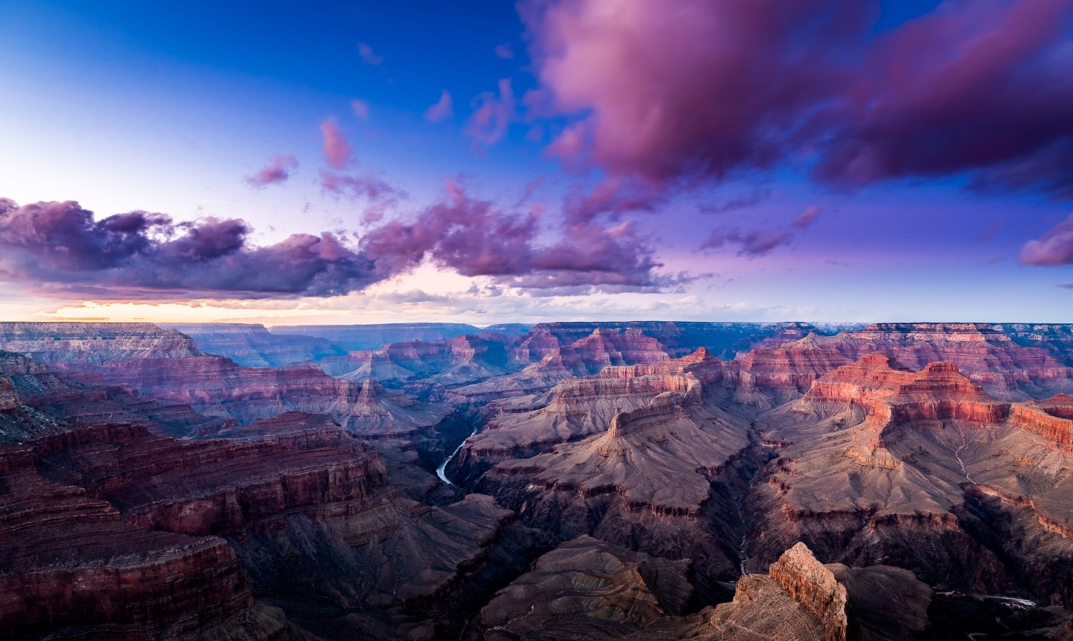 Sweeping view of the Grand Canyon at dusk.