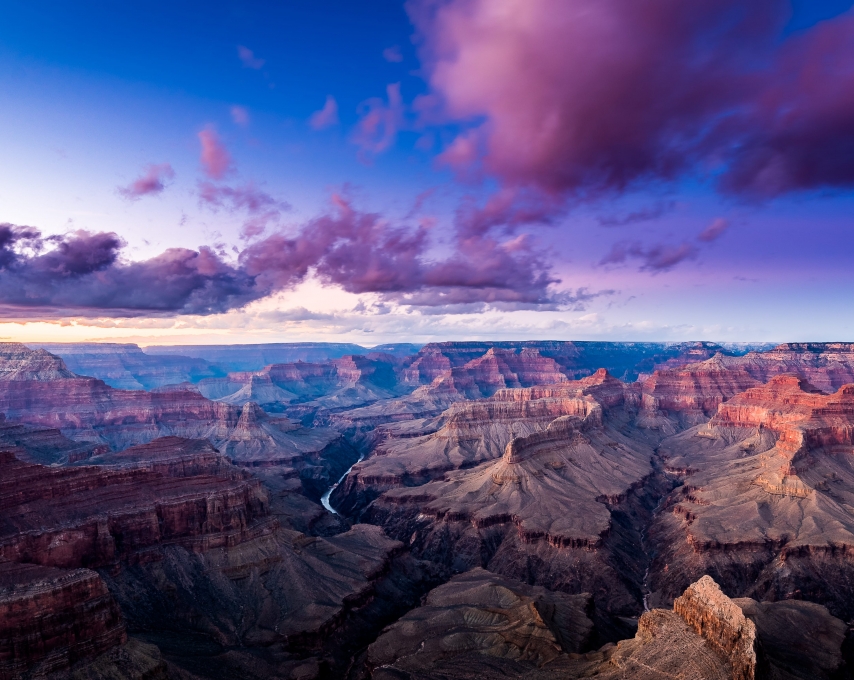 Sweeping view of the Grand Canyon at dusk.