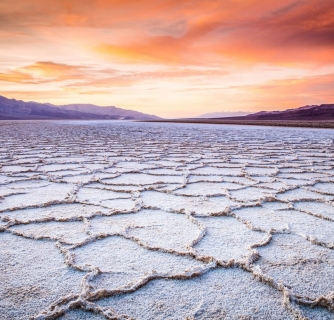 The sunsets over the Badwater landscape in Death Valley National Park.
