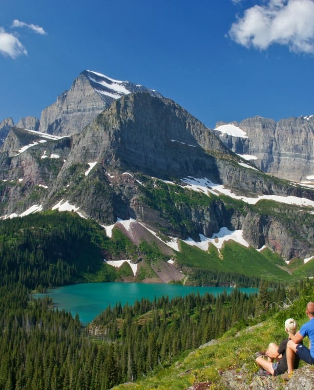 Young Couple enjoying the view in Glacier National Park in northern Montana