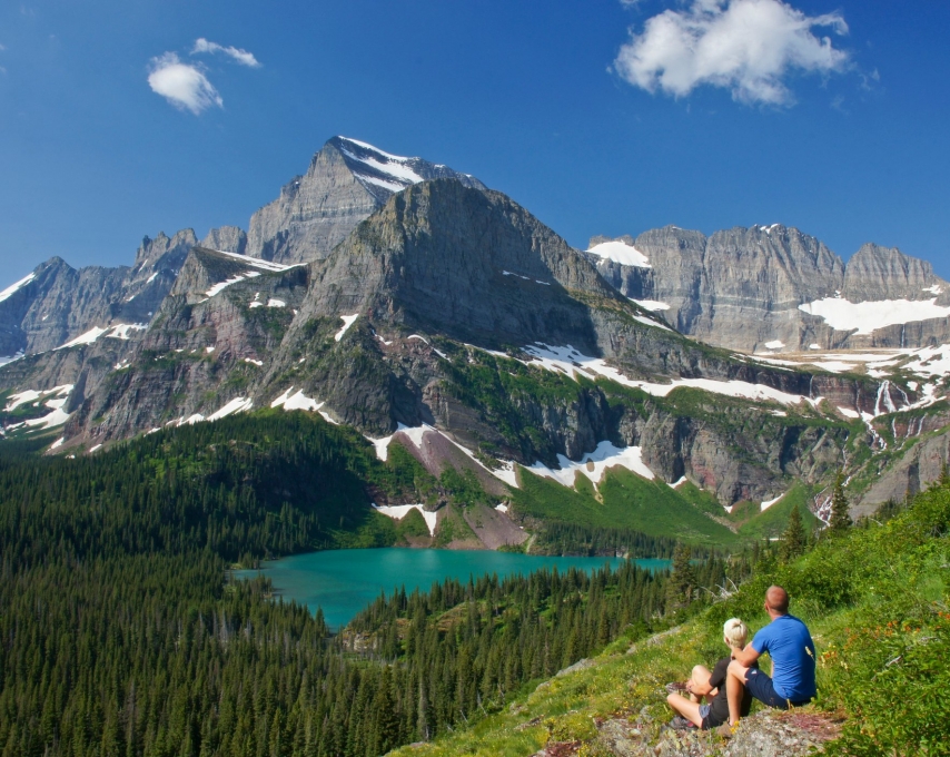 Young Couple enjoying the view in Glacier National Park in northern Montana
