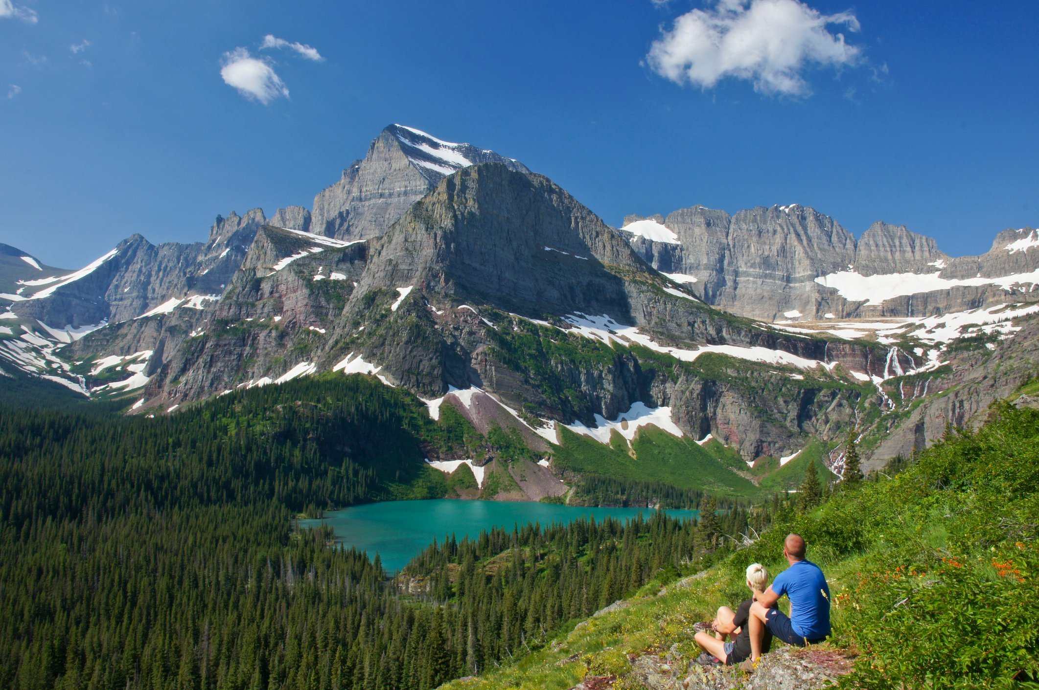 Young Couple enjoying the view in Glacier National Park in northern Montana