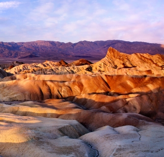 Rippling sand dunes at sunset