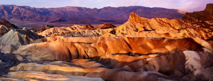 Rippling sand dunes at sunset