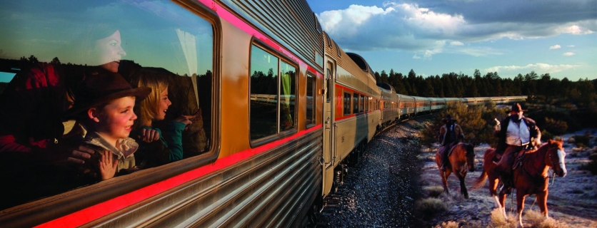 Kids watching cowboys from the train