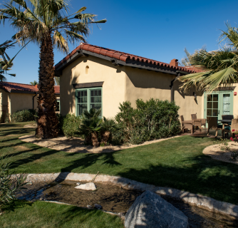 Stone property next to palm trees