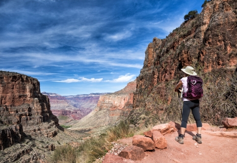 mature female hiker enjoying the view on the soutern rim of the Grand Canyon