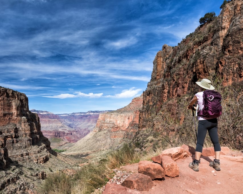 mature female hiker enjoying the view on the soutern rim of the Grand Canyon