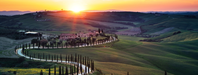 Tuscany landscape with winding country road at sunset (Val D'orcia, Italy).