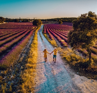 couple mid age men and woman on vacation in the Provence visiting the blooming lavender fields in France. Europe